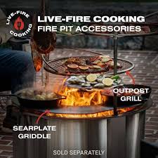 Live-fire cooking accessories shown with a fire pit